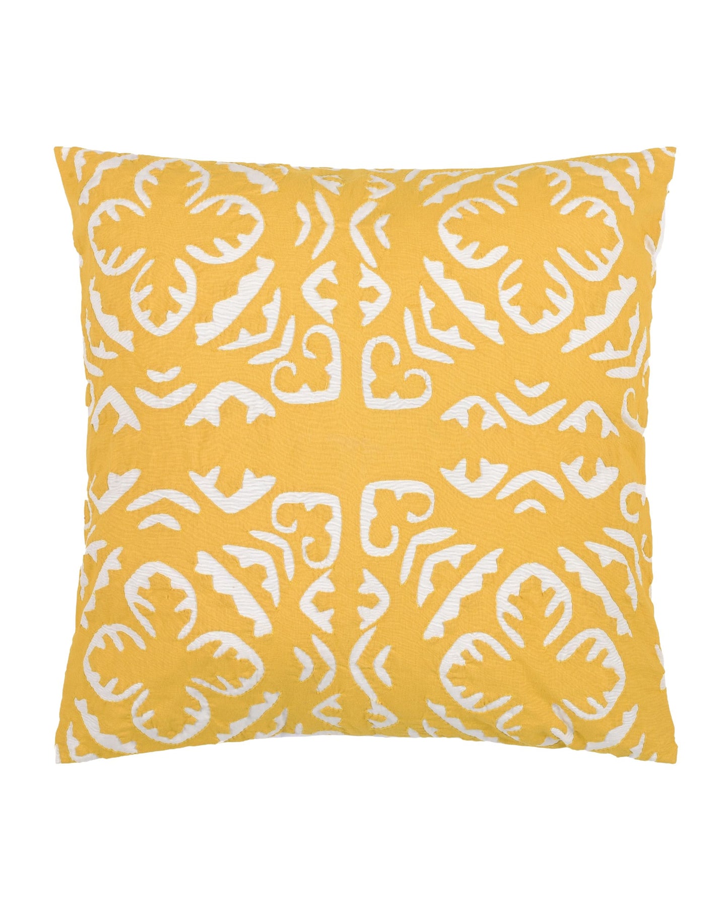 Yellow pillow with white pattern on a gray couch