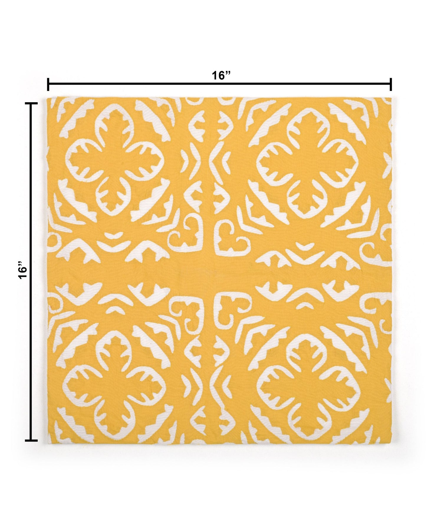 Yellow pillow with white pattern on a gray couch