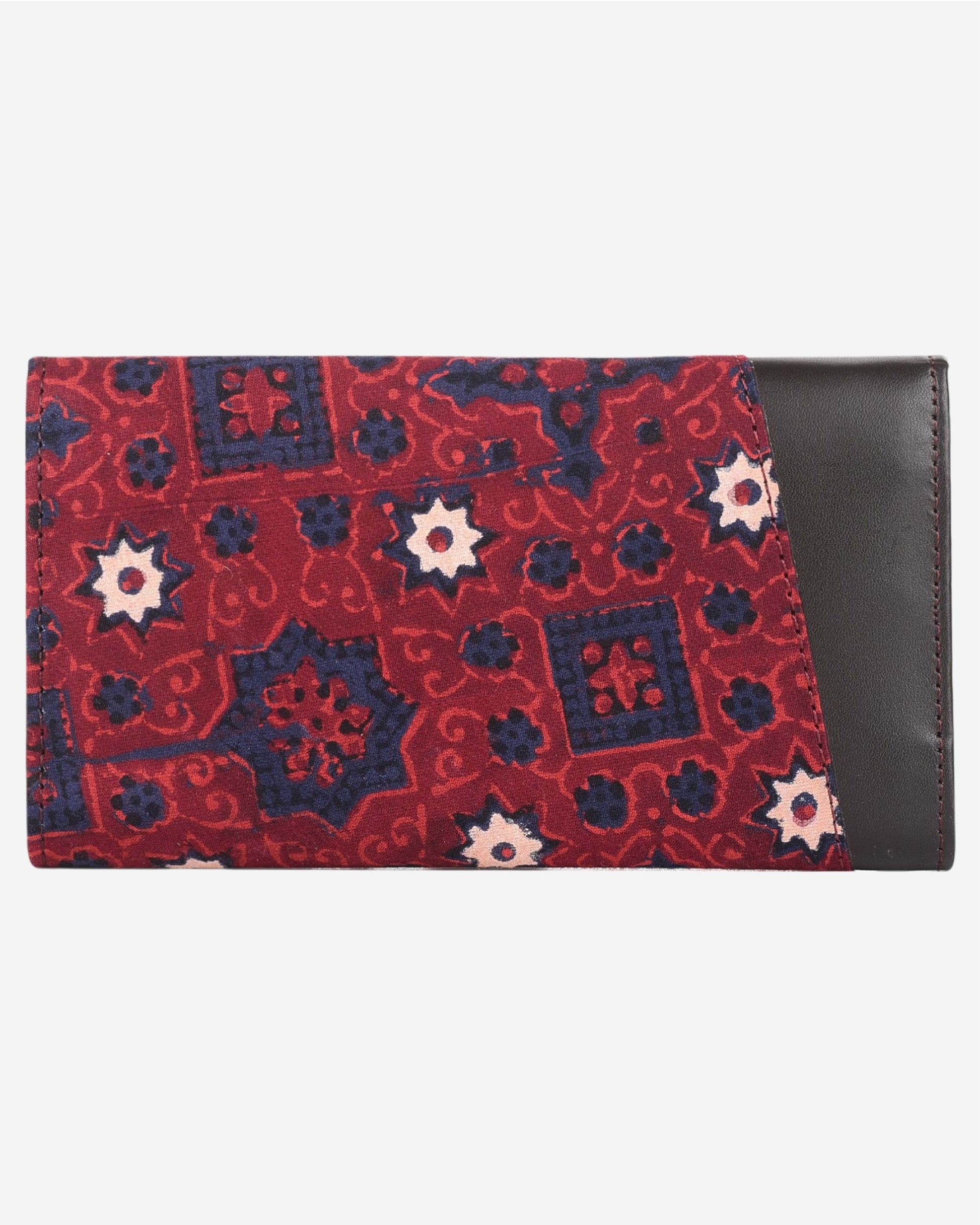 Red and blue patterned clutch bag with a leather flap on a white background