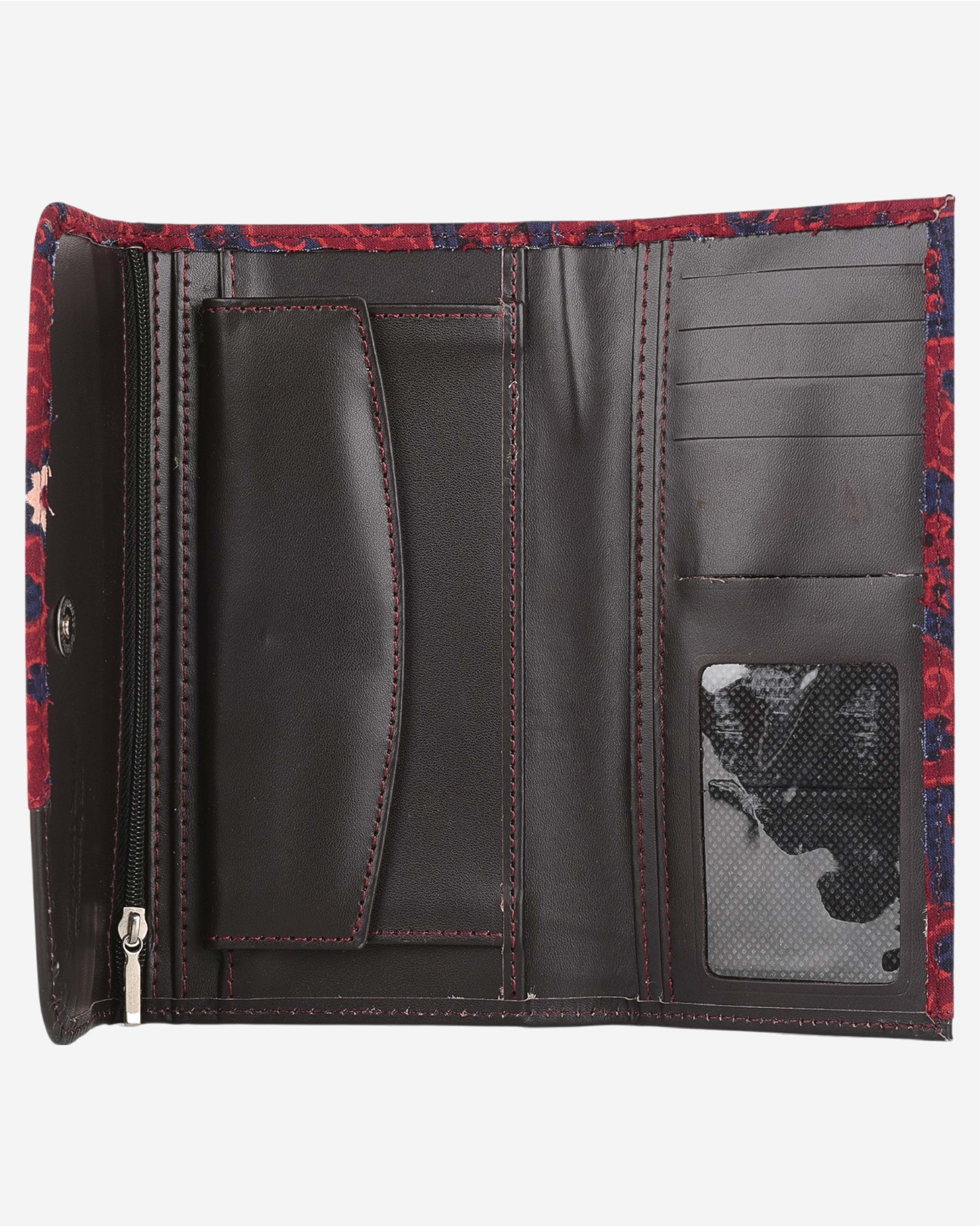 Red and blue patterned clutch bag with a leather flap on a white background