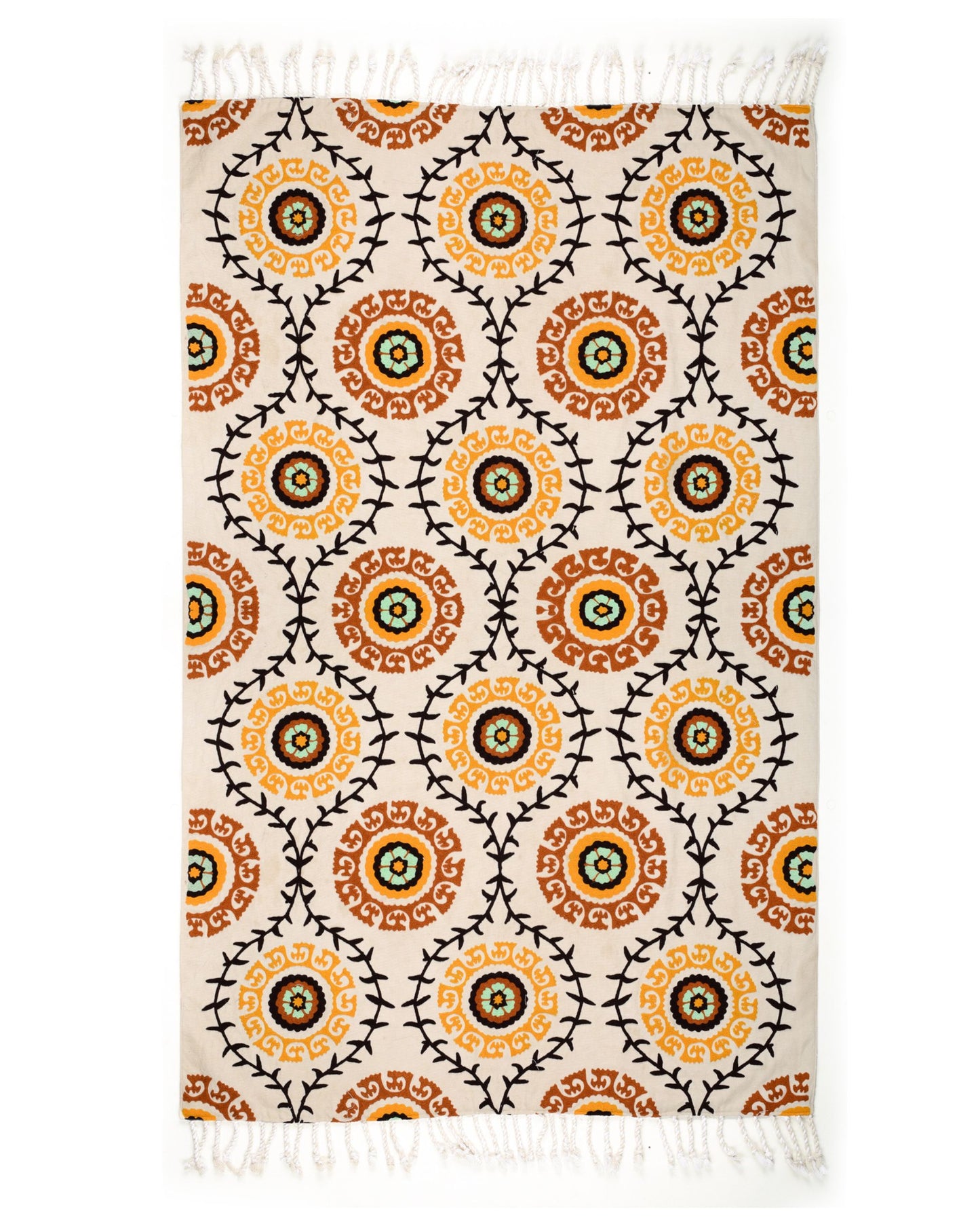 Patterned rug with orange and black circles on a white background