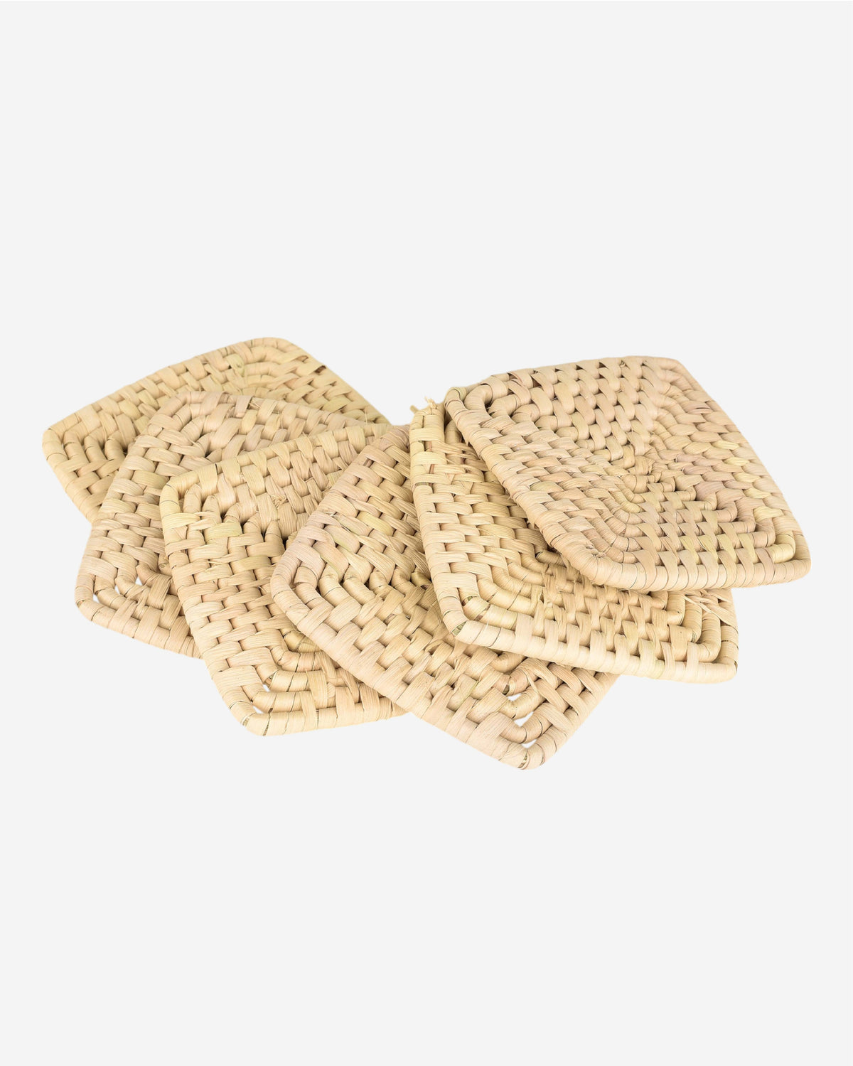 Set of woven beige coasters on a white background
