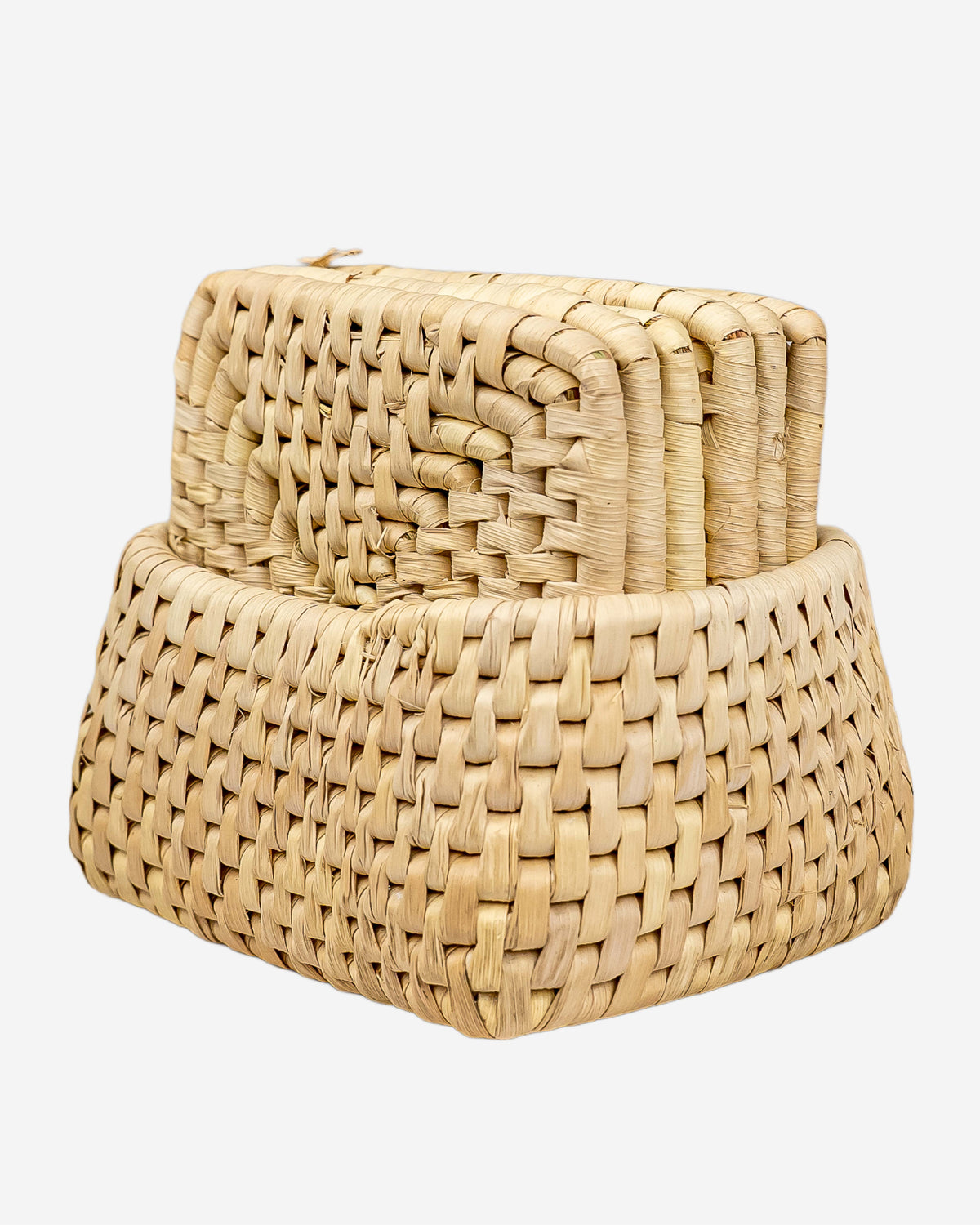 Set of woven beige coasters on a white background