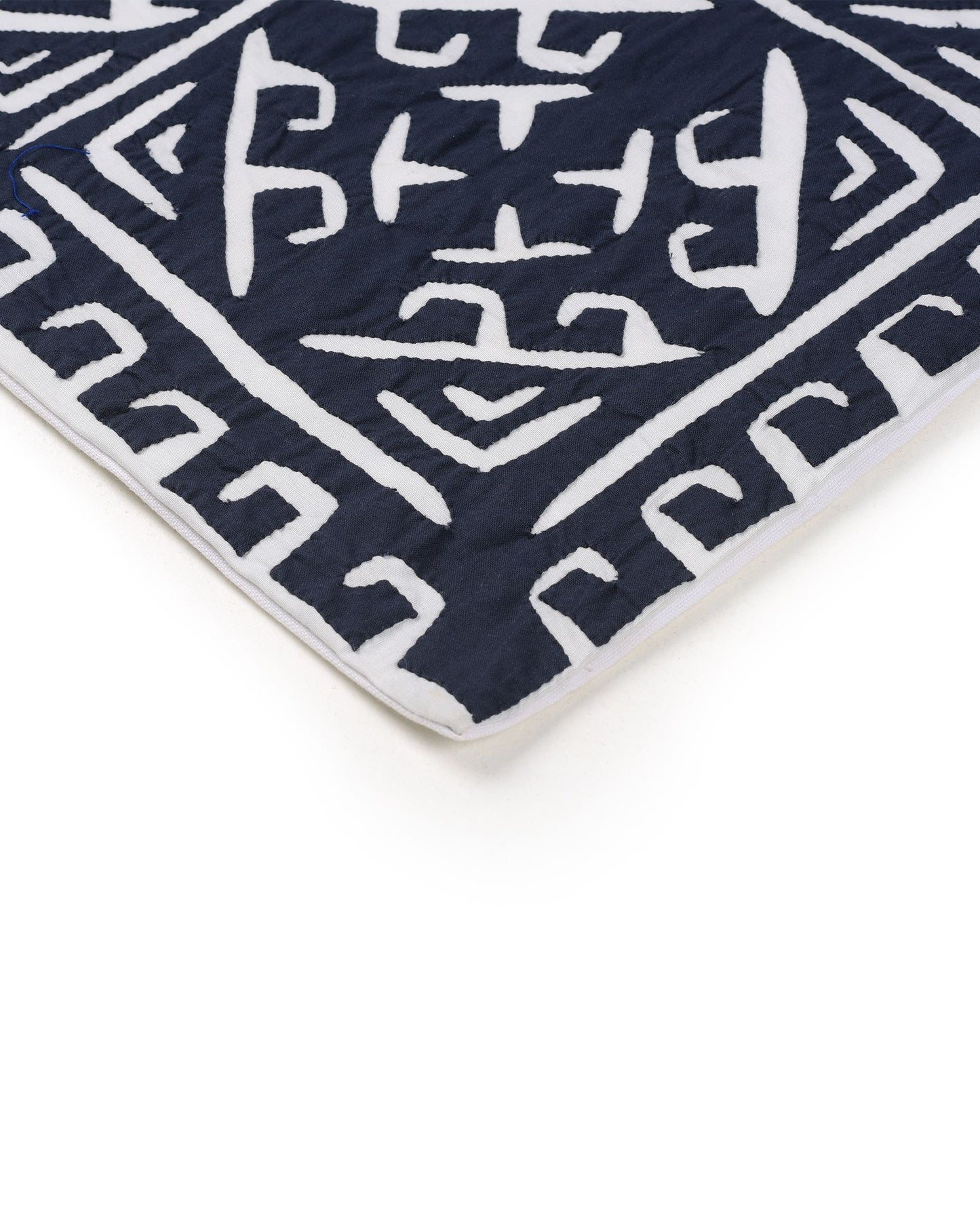 Navy blue fabric with white geometric pattern and measurements on a white background