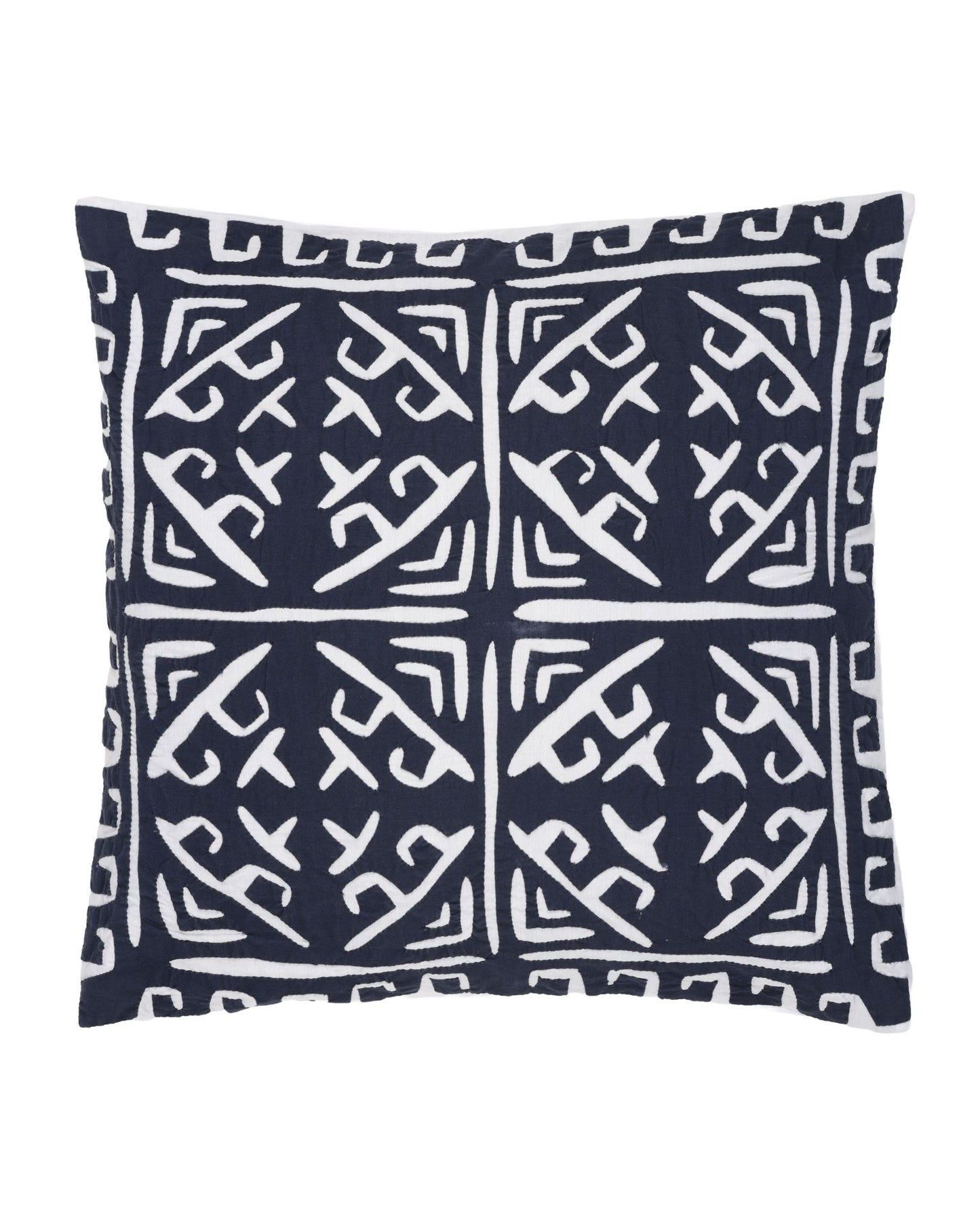 Navy pillow with white geometric pattern on a white background