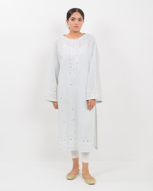 Woman wearing a white hurmich mirror work lawn shirt on a white background