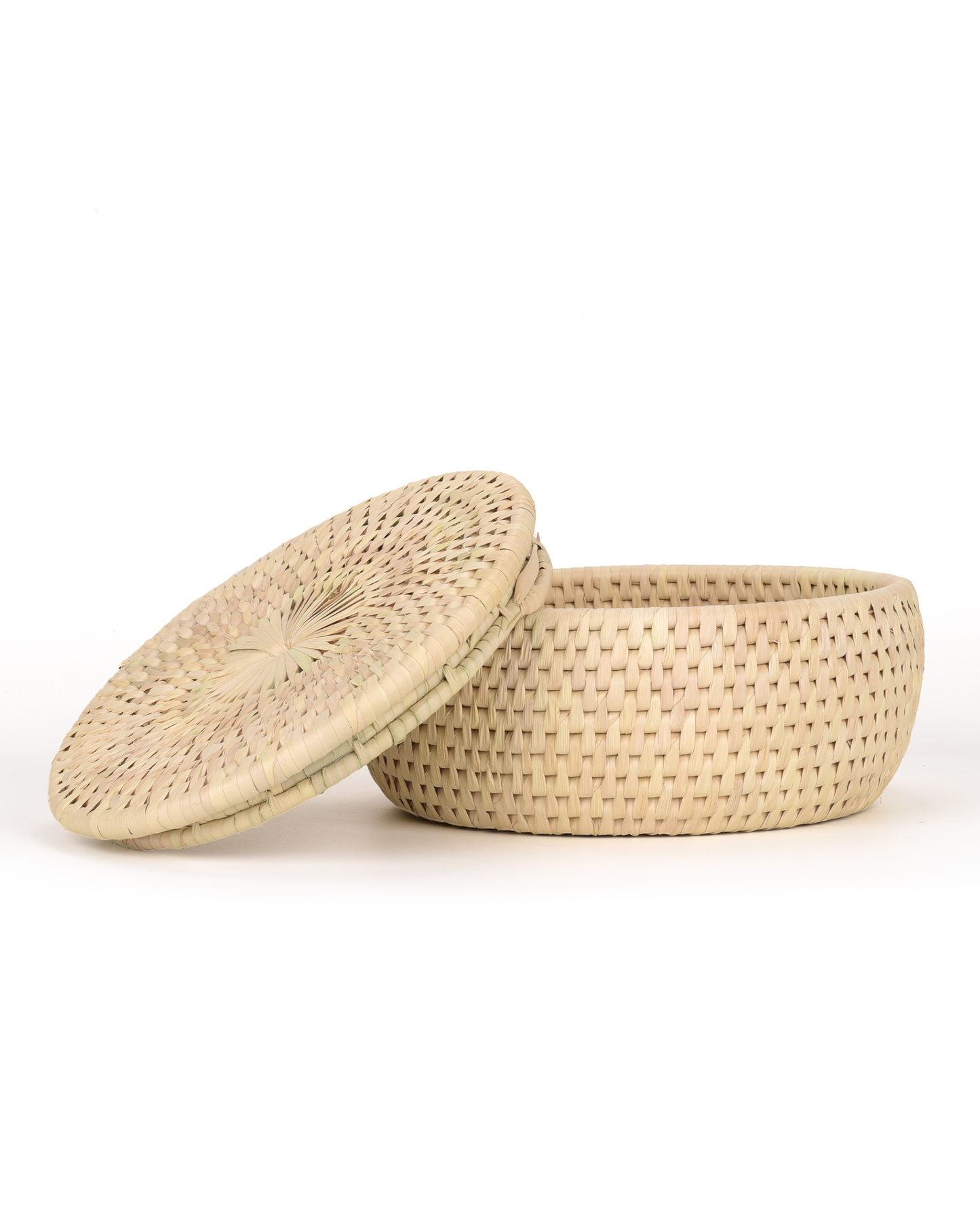 Woven basket with lid on a white background