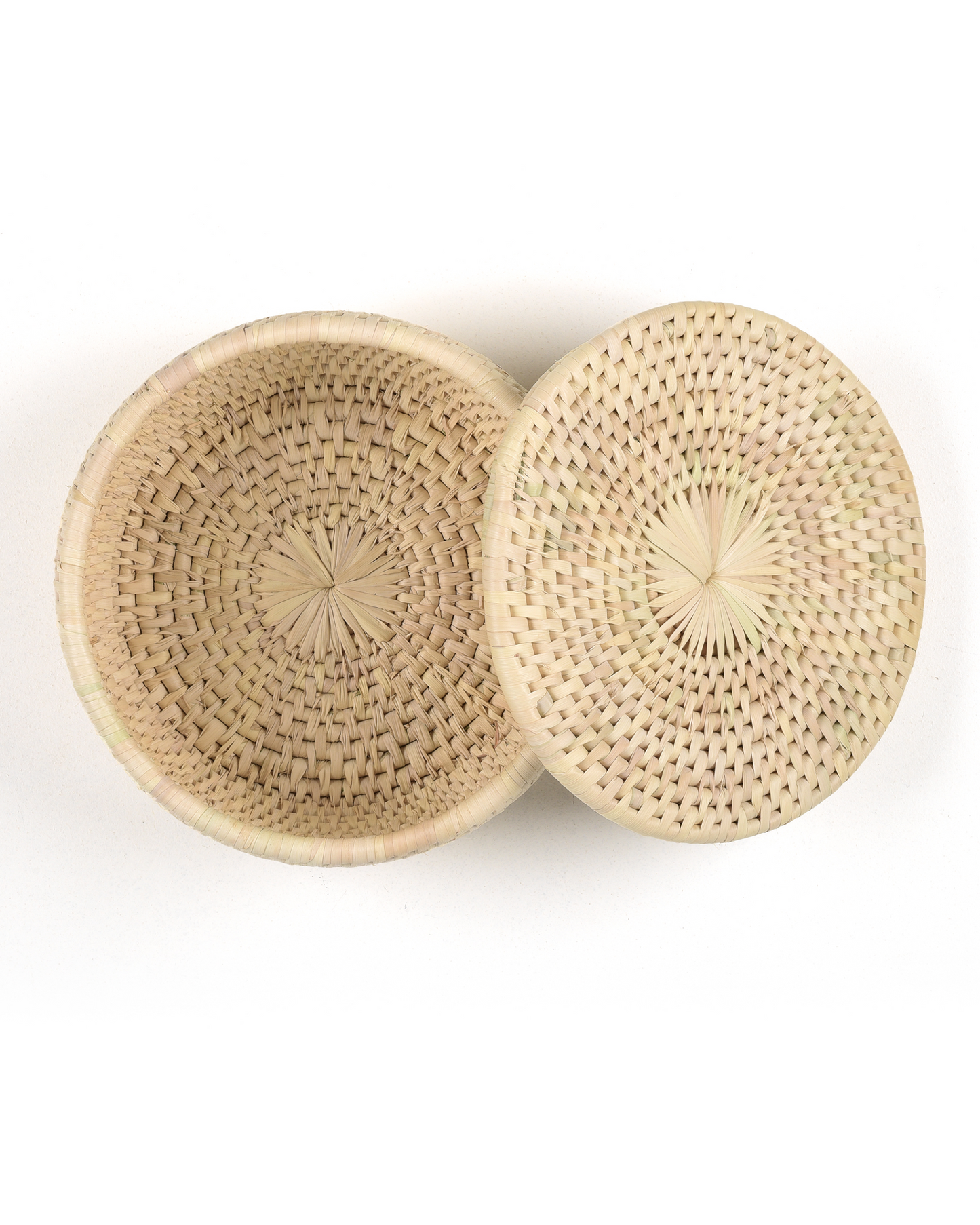 Woven basket with lid on a white background