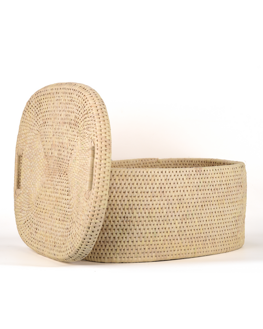 Woven beige storage basket with lid on a white background