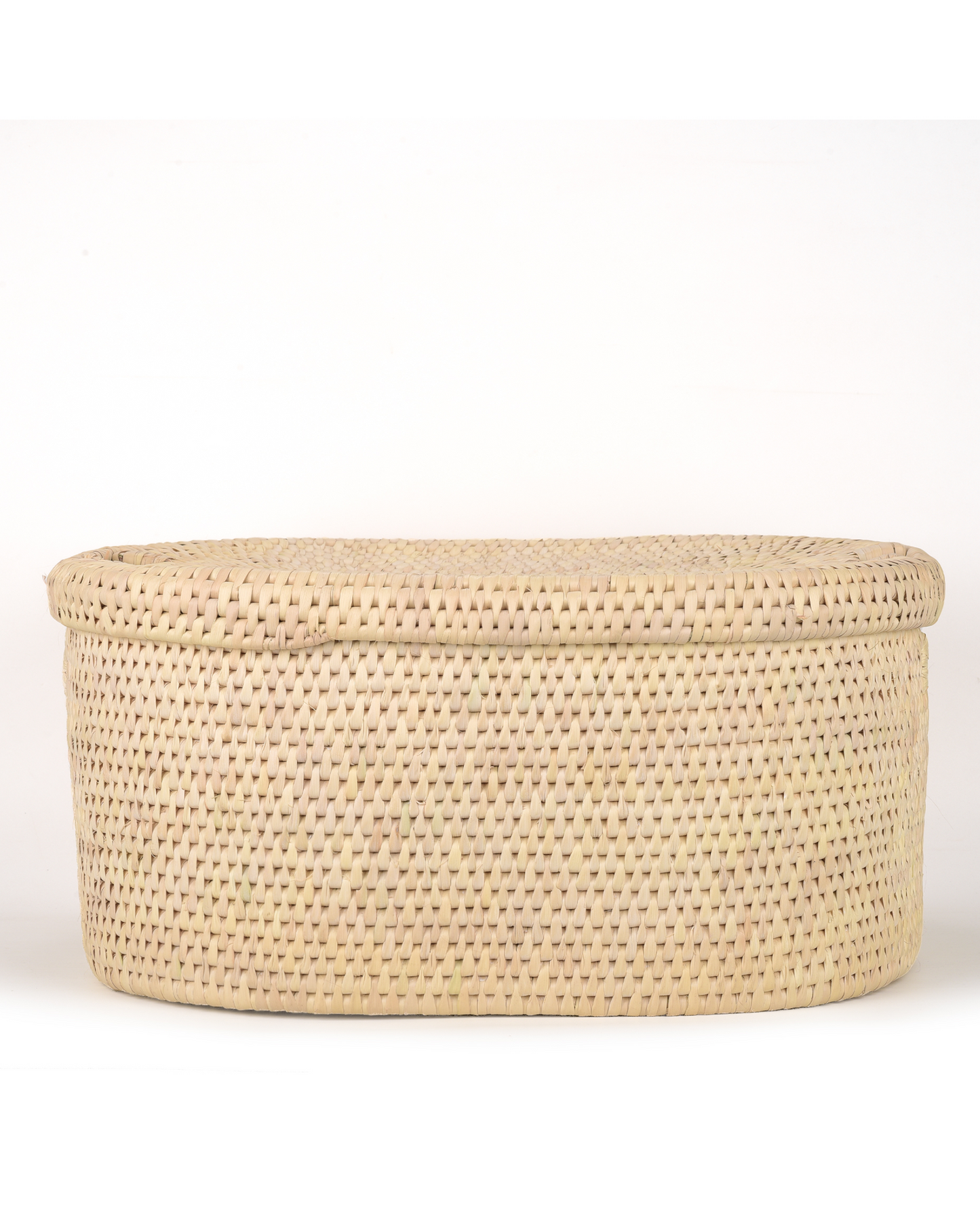 Woven beige storage basket with a lid on a white background
