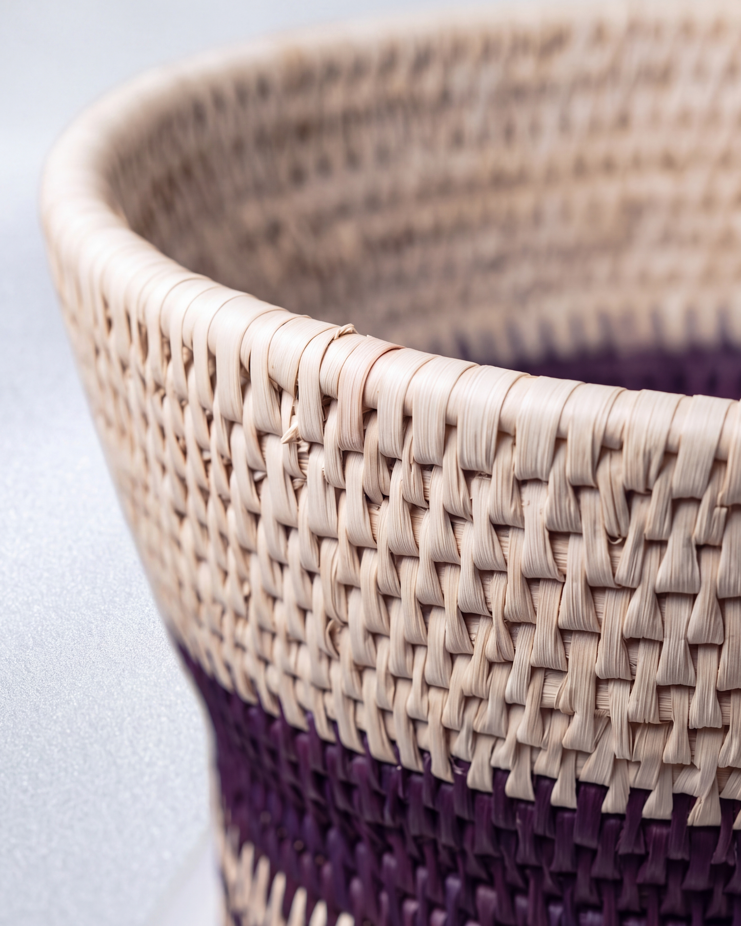 Multipurpose handwoven date-leaf basket with maroon and natural woven pattern