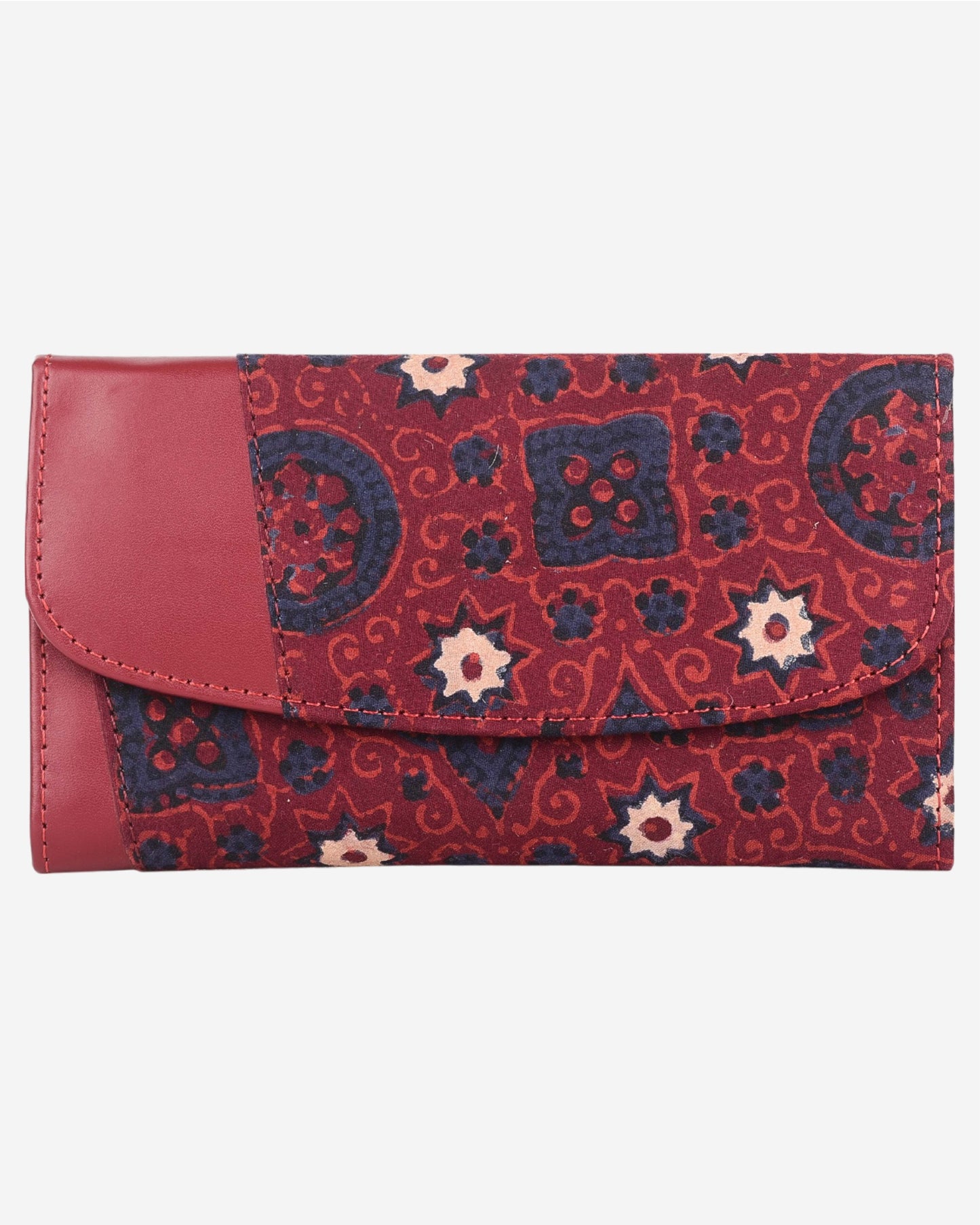 Red and blue patterned clutch bag with a leather flap on a white background
