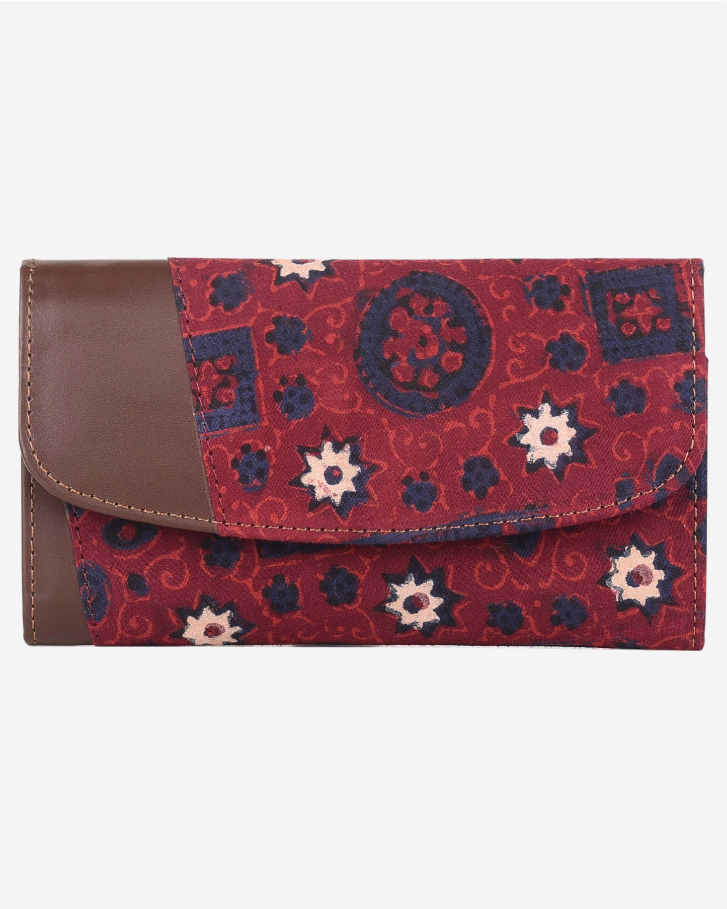Red and blue patterned clutch bag with a leather flap on a white background