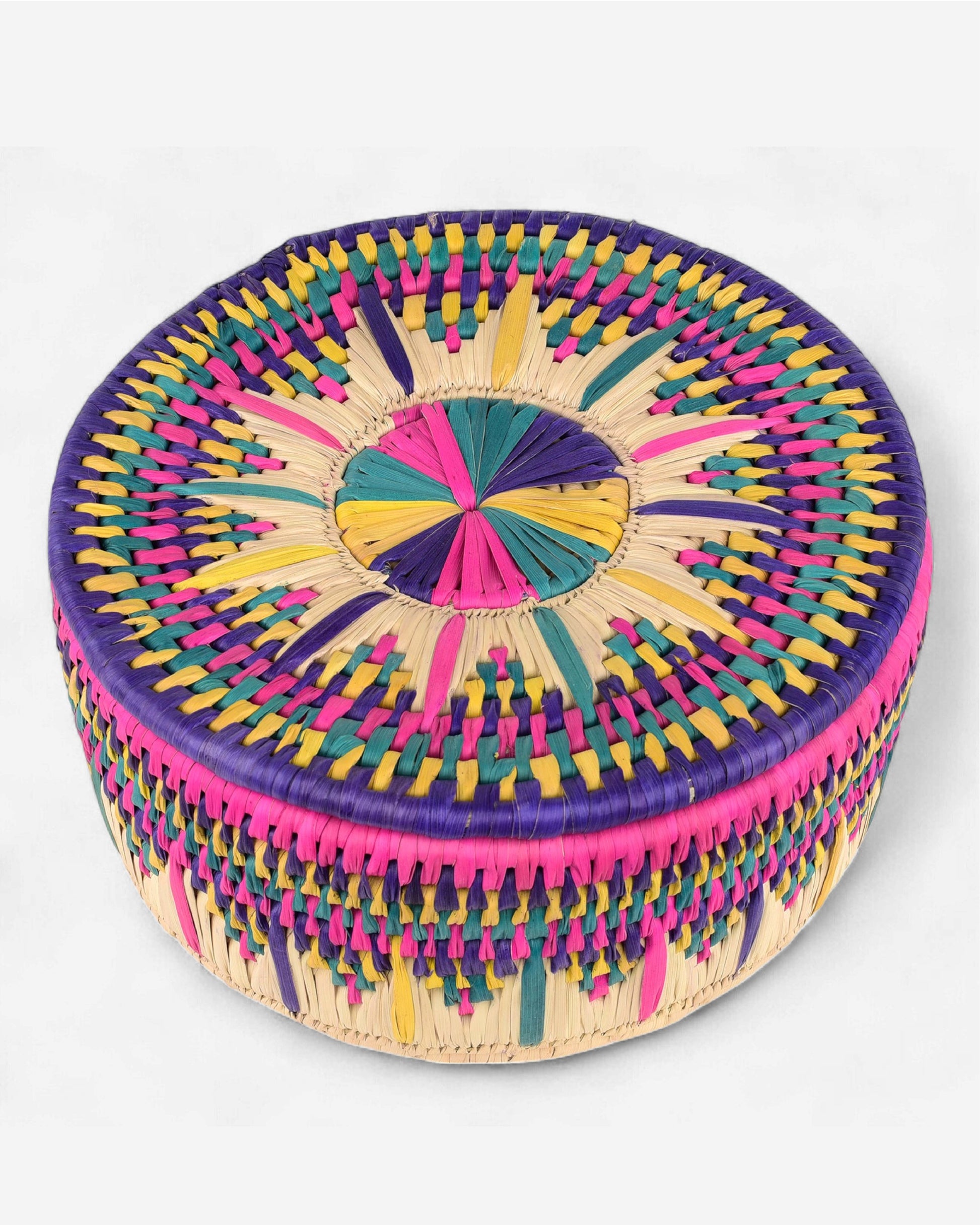 Colorful woven basket with a circular design on a white background