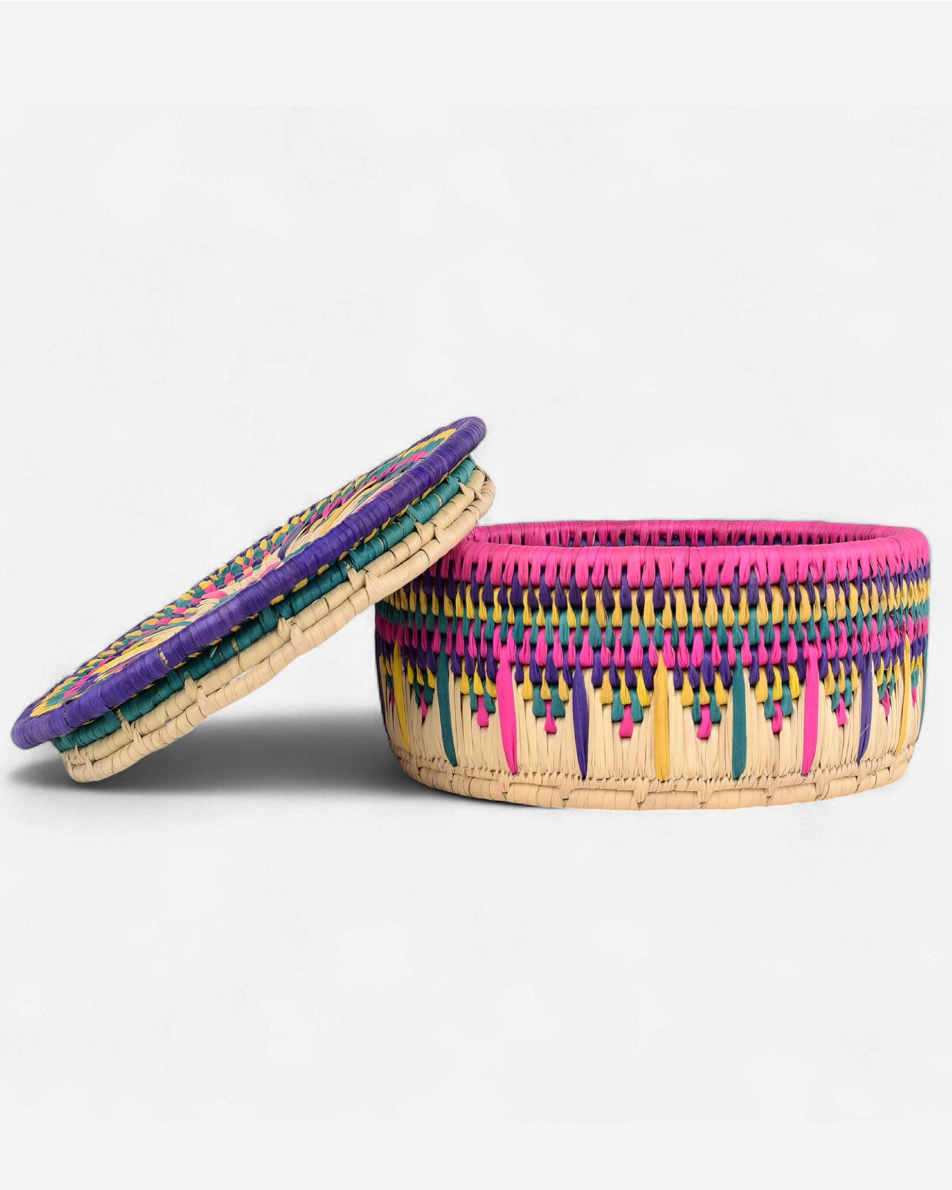 Colorful woven basket with a circular design on a white background