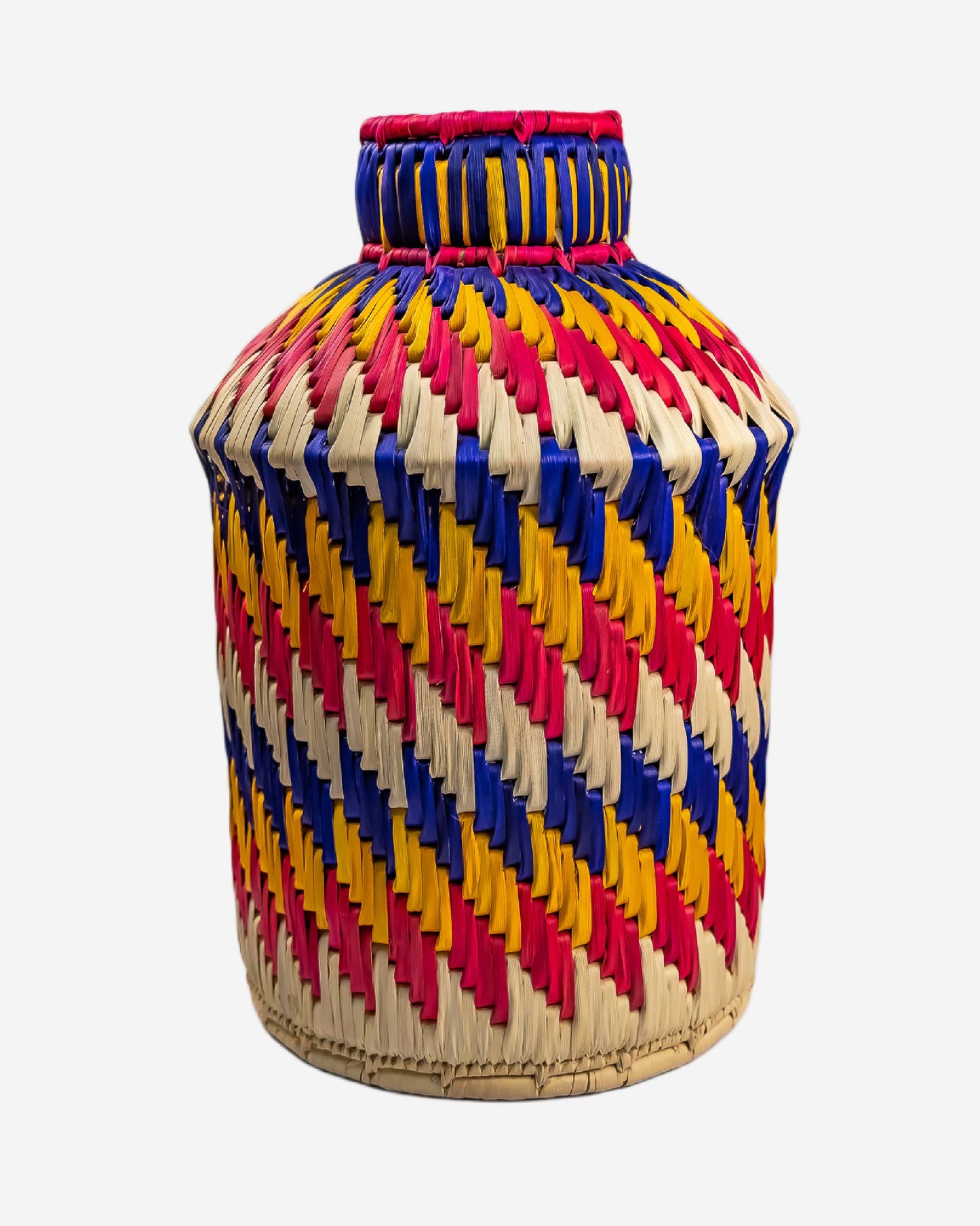 Colorful woven vase with a zigzag pattern on a white background