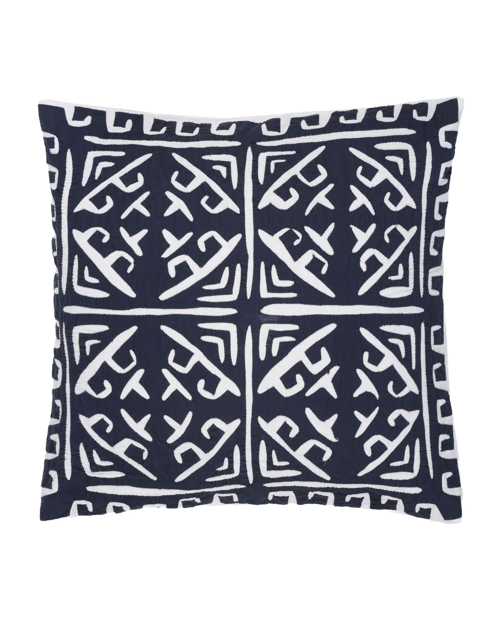 Navy pillow with white geometric pattern on a white background