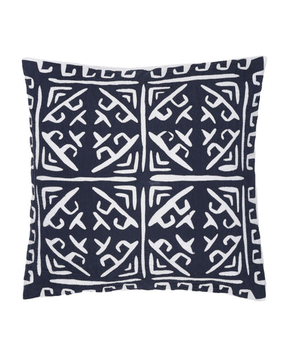 Navy pillow with white geometric pattern on a white background