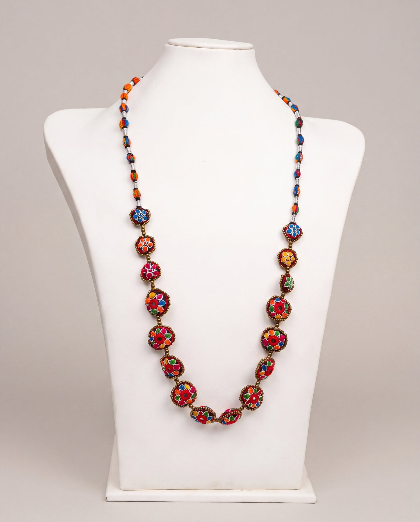 Handmade Balochi mirror flower necklace with colorful embroidered floral motifs, golden beads, silver thread, and traditional artisan craftsmanship from Pakistan.
