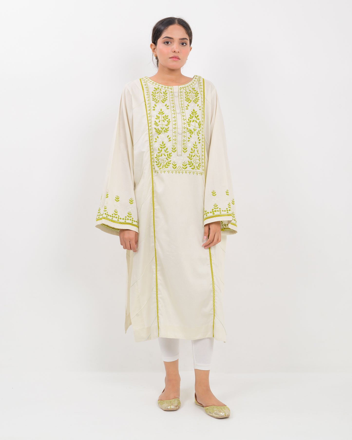 Woman wearing a light green kachi sui embroidery shirt on a white background