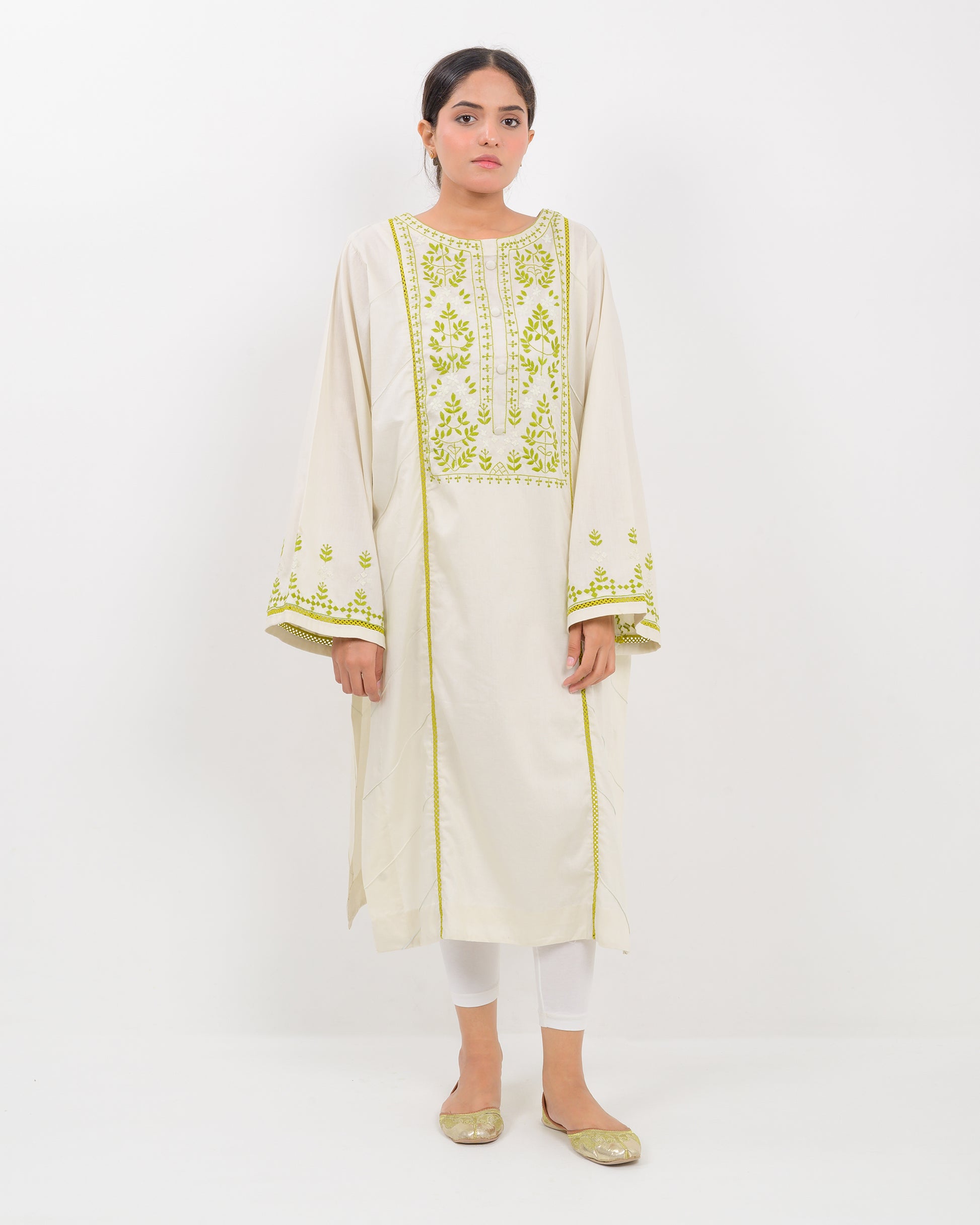 Woman wearing a light green kachi sui embroidery shirt on a white background