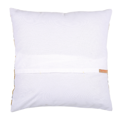 Decorative pillow with yellow and gray pattern on a gray sofa