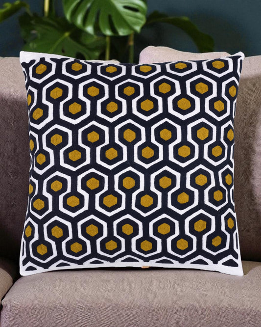 Decorative pillow with a geometric pattern on a couch