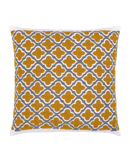 Decorative pillow with yellow and gray pattern on a gray sofa