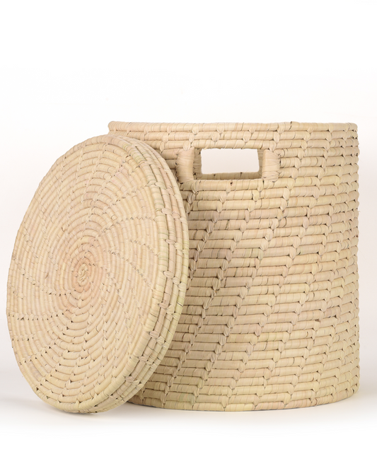 Woven beige storage basket with a matching lid on a white background