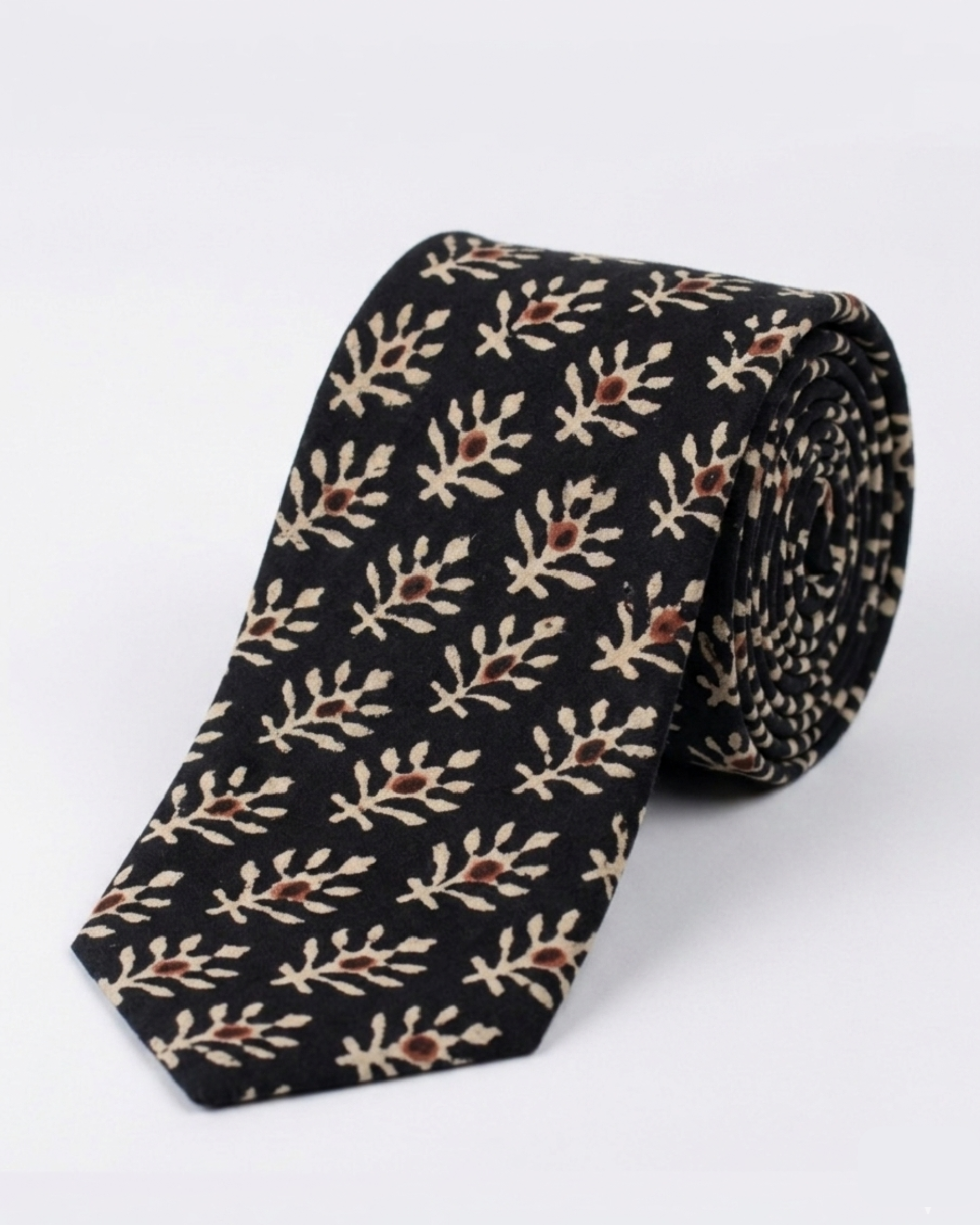 
Natural dye hand block print cotton tie with pure black base and cream botanical leaf sprigs with rust brown flower bud motifs handcrafted in Sindh PakistanYou said: color