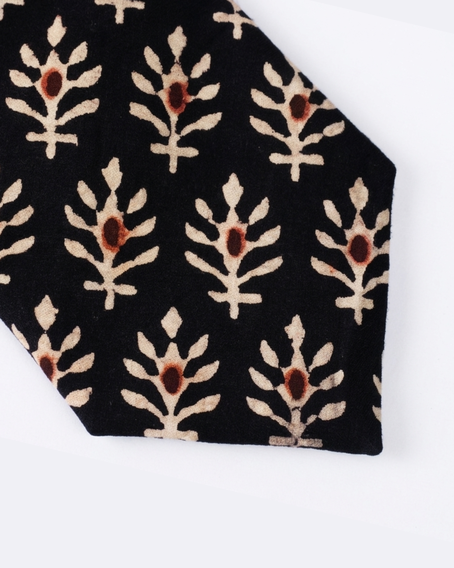 
Natural dye hand block print cotton tie with pure black base and cream botanical leaf sprigs with rust brown flower bud motifs handcrafted in Sindh PakistanYou said: color