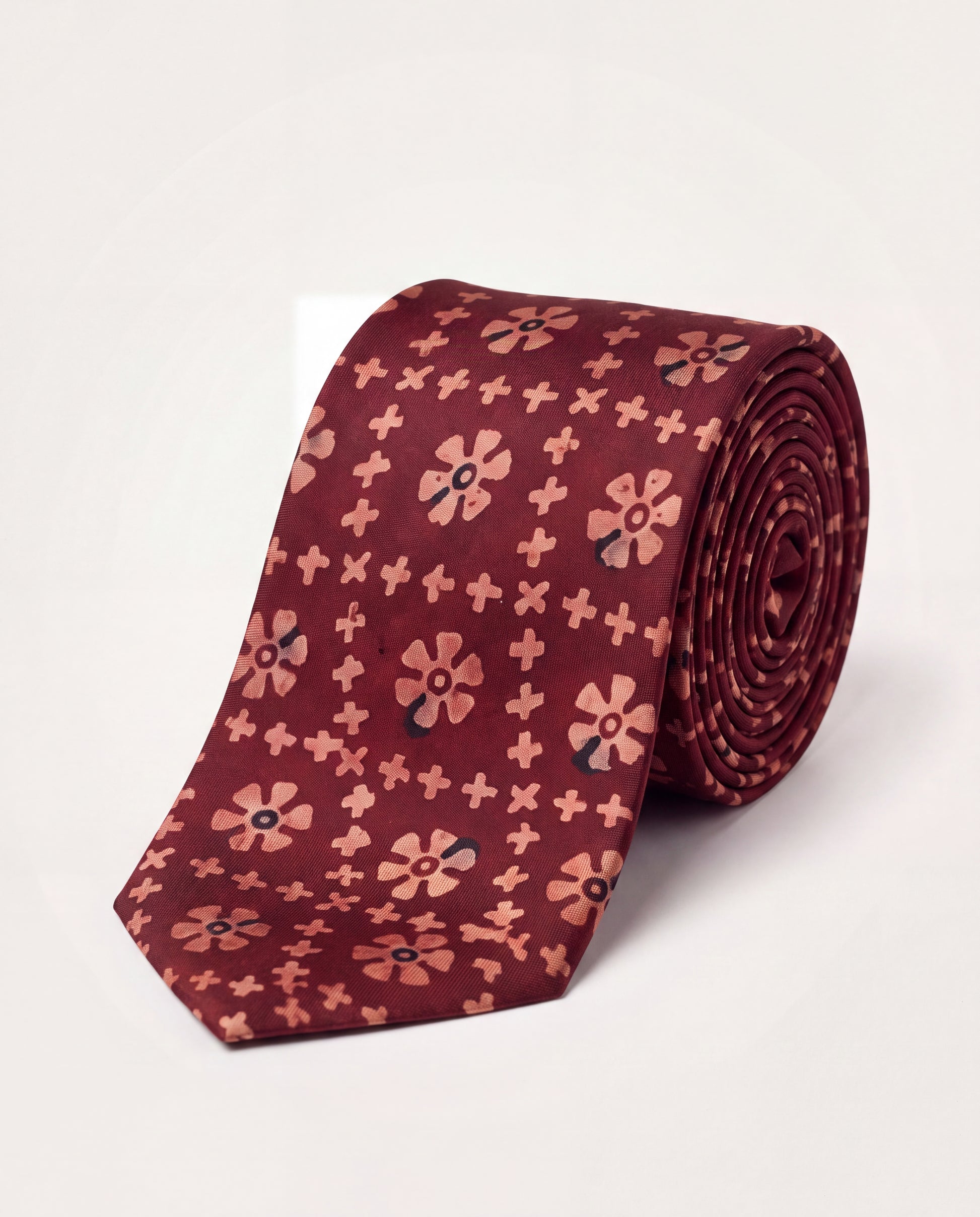 Handcrafted natural dye block print silk necktie in maroon with traditional floral pattern, premium artisan men's formal tie.