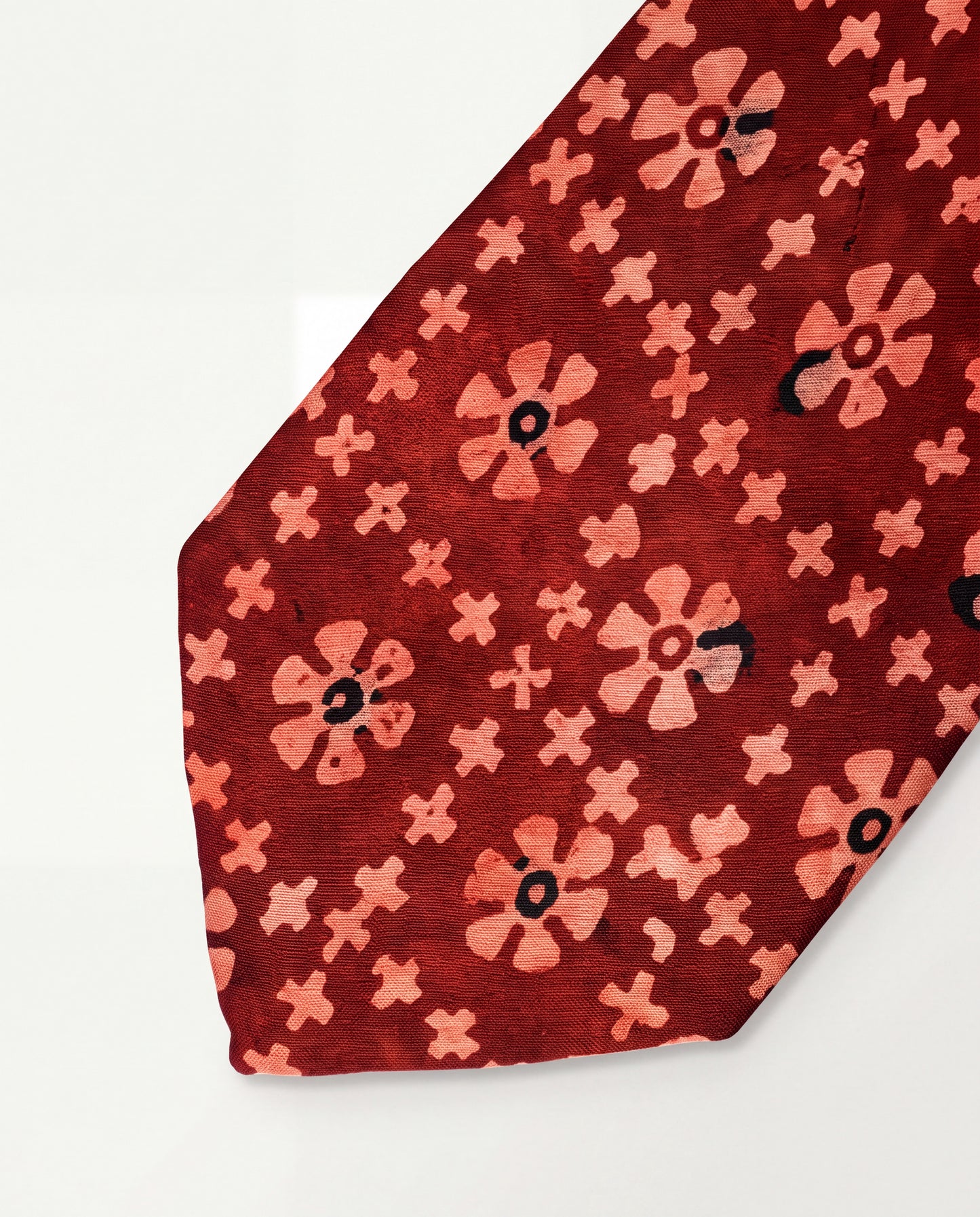 Handcrafted natural dye block print silk necktie in maroon with traditional floral pattern, premium artisan men's formal tie.
