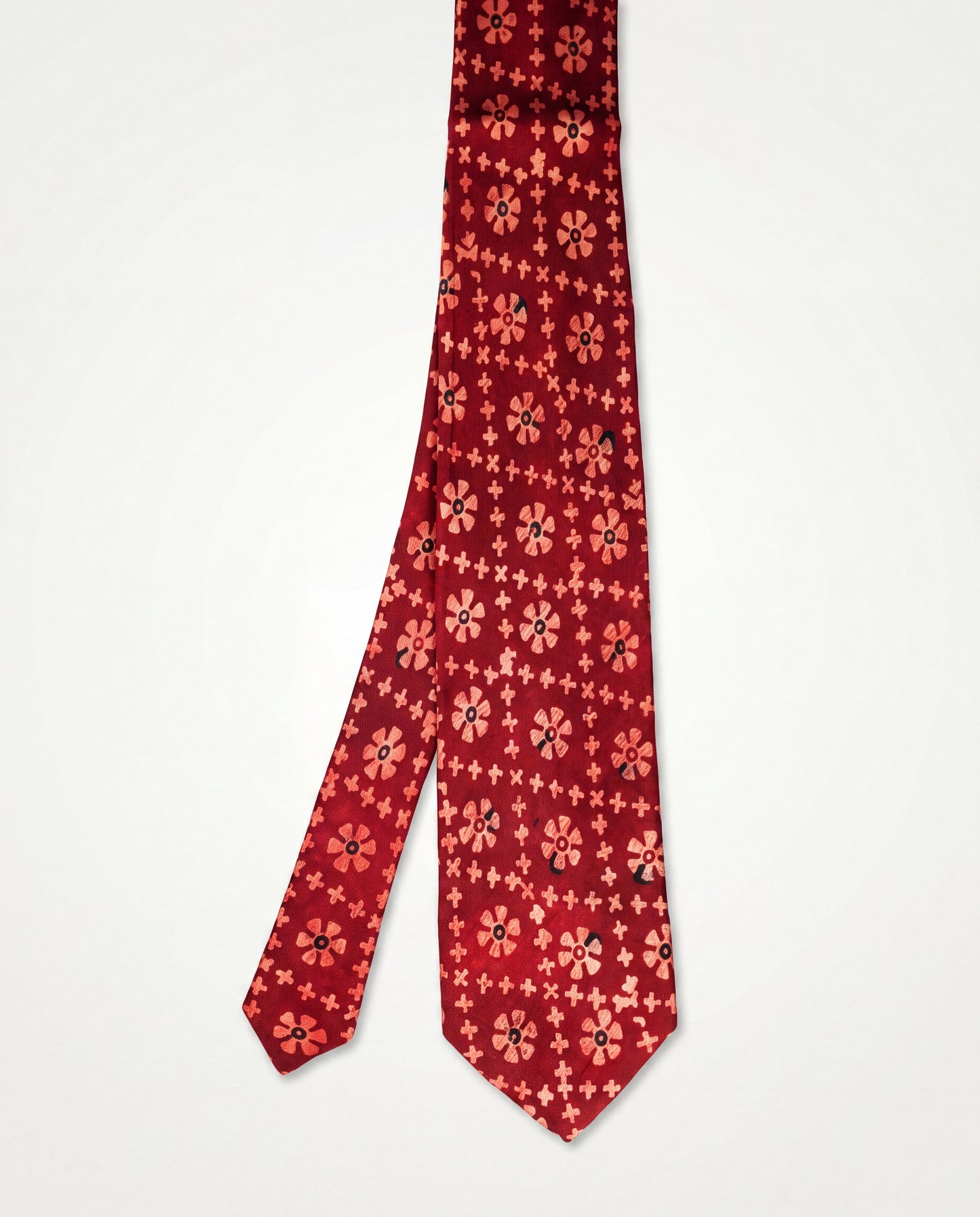 Handcrafted natural dye block print silk necktie in maroon with traditional floral pattern, premium artisan men's formal tie.