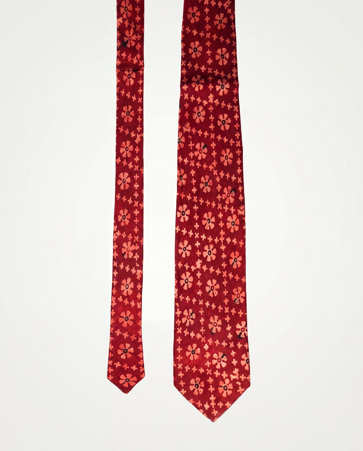 Handcrafted natural dye block print silk necktie in maroon with traditional floral pattern, premium artisan men's formal tie.