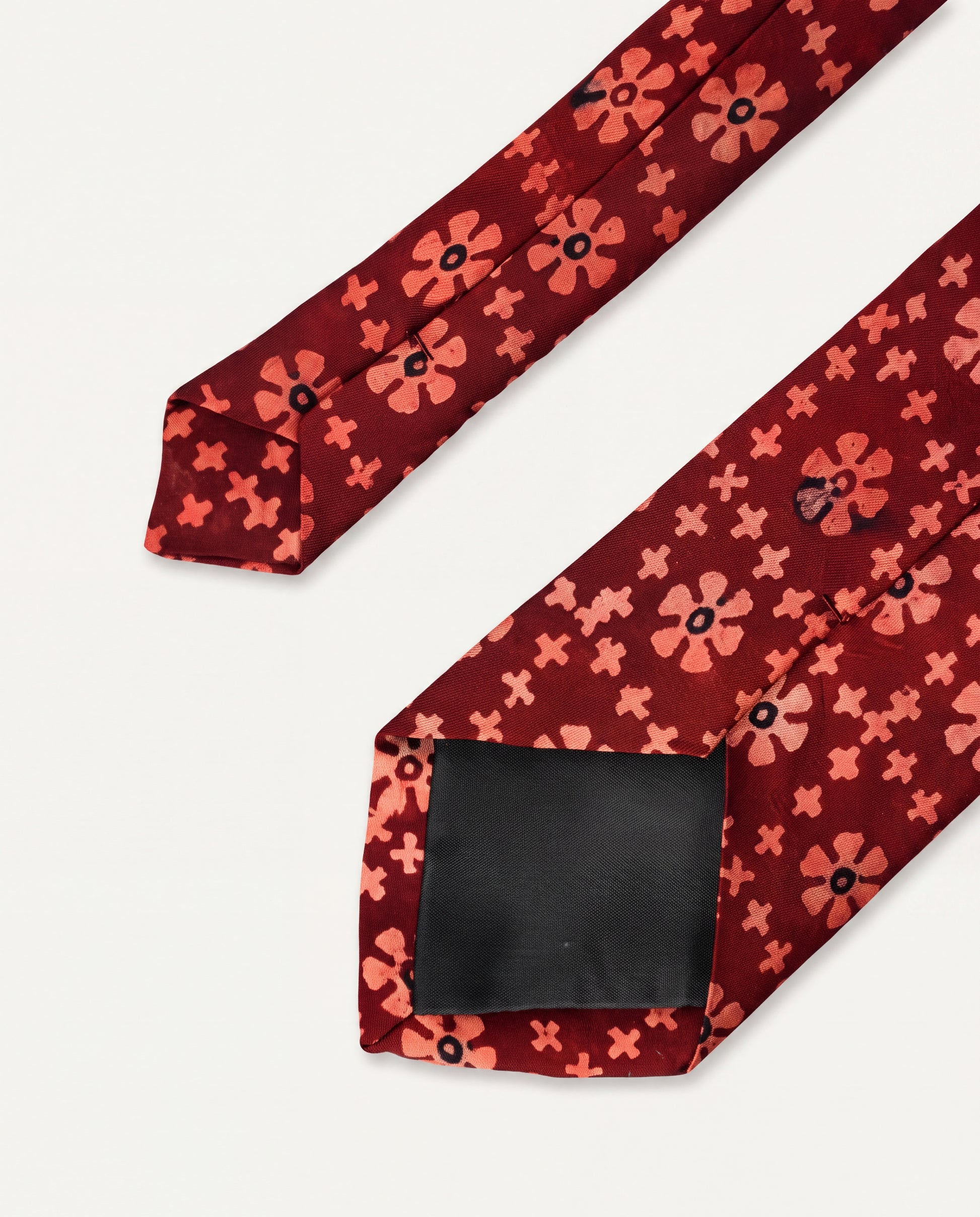 Handcrafted natural dye block print silk necktie in maroon with traditional floral pattern, premium artisan men's formal tie.