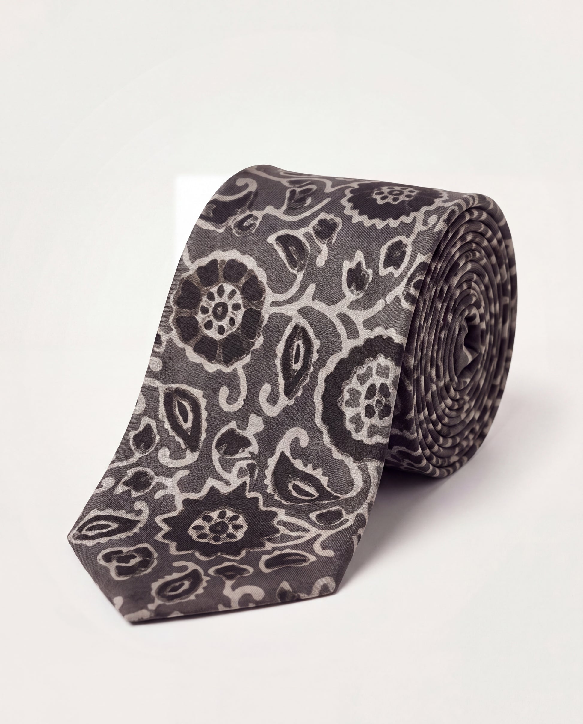 Silver Ash Natural Dye Silk Necktie handcrafted from premium silk with elegant hand block printed floral motifs in silver grey and black.