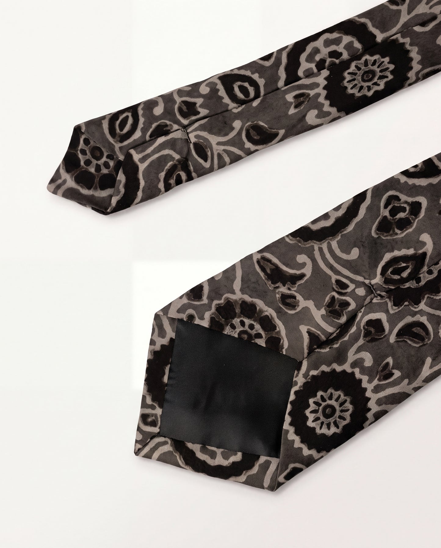 Silver Ash Natural Dye Silk Necktie handcrafted from premium silk with elegant hand block printed floral motifs in silver grey and black.