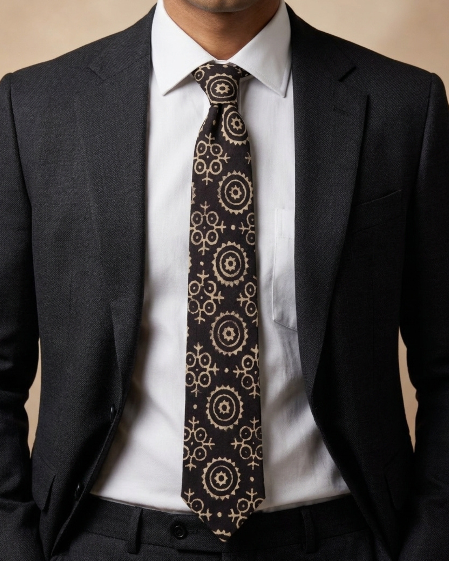 Lunar Eclipse natural dye Ajrak hand block print cotton tie in black with ivory geometric motifs, handcrafted by artisans in Sindh, Pakistan.