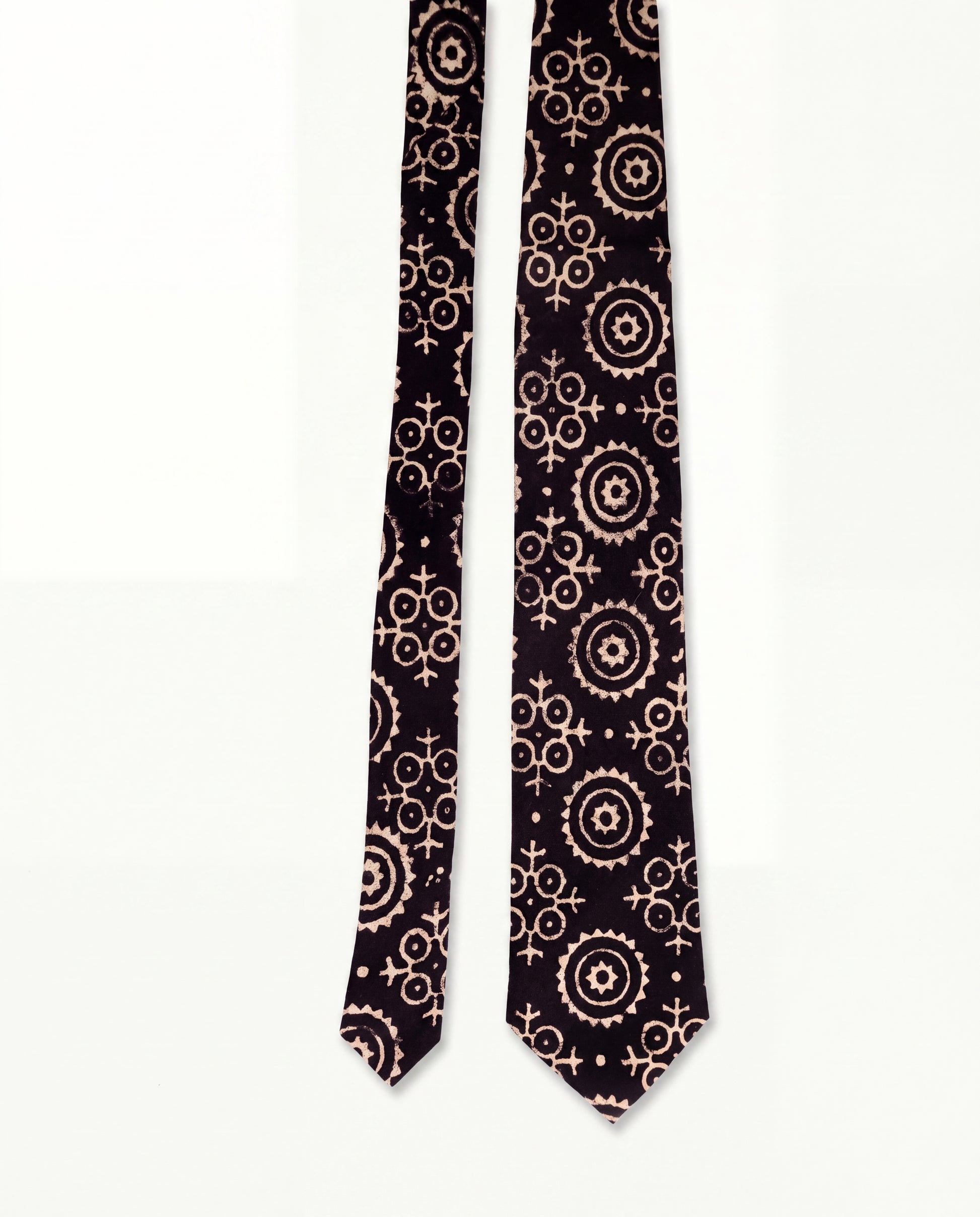 Lunar Eclipse natural dye Ajrak hand block print cotton tie in black with ivory geometric motifs, handcrafted by artisans in Sindh, Pakistan.