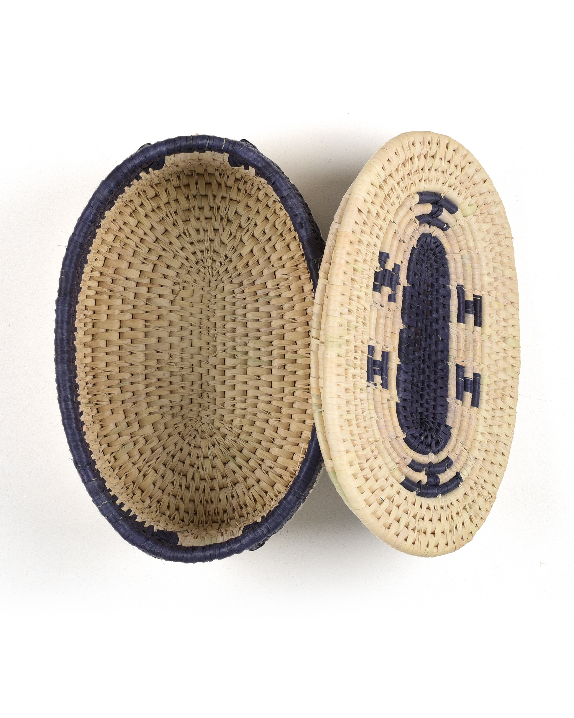 Woven basket with a lid on a white background