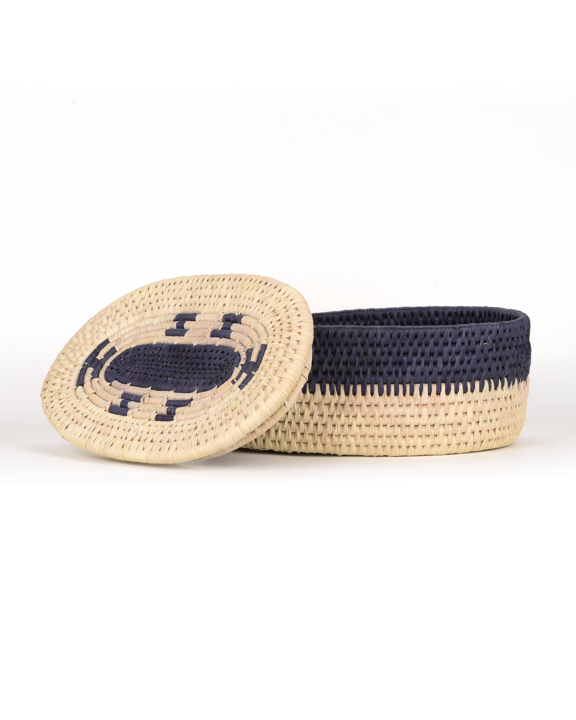 Woven basket with a lid on a white background