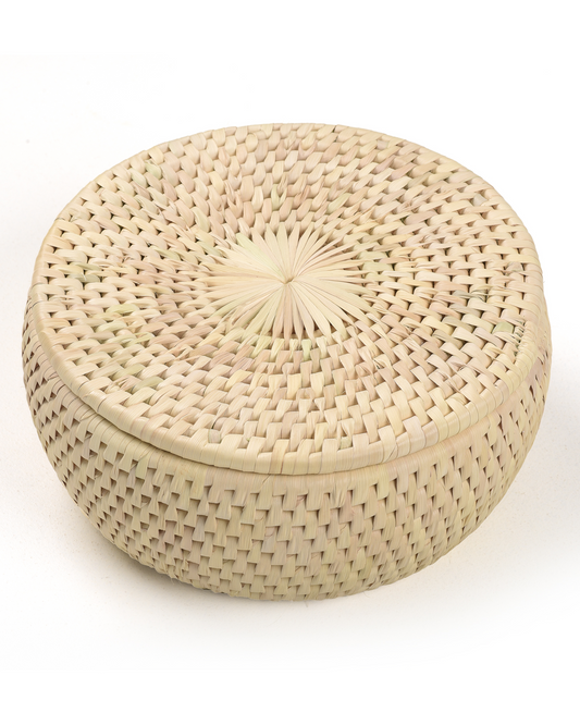 Woven basket with lid on a white background