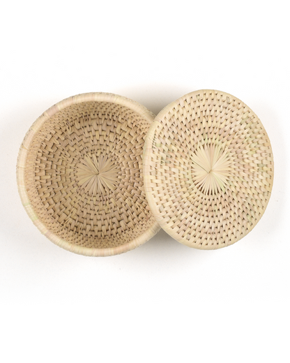 Woven basket with lid on a white background