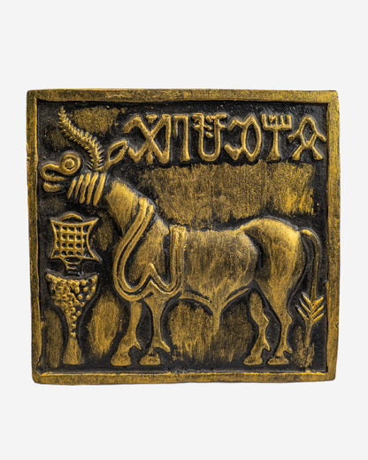 Bronze plaque with a bull and ancient script, Clay Sculpture. Mohen-Jo-Daro Ancient Seal Clay