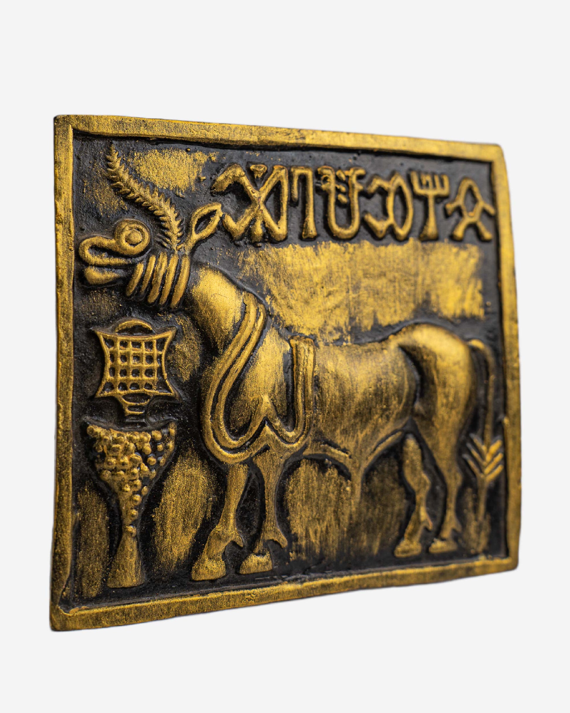 Bronze plaque with a bull and ancient script, Clay Sculpture. Mohen-Jo-Daro Ancient Seal Clay
