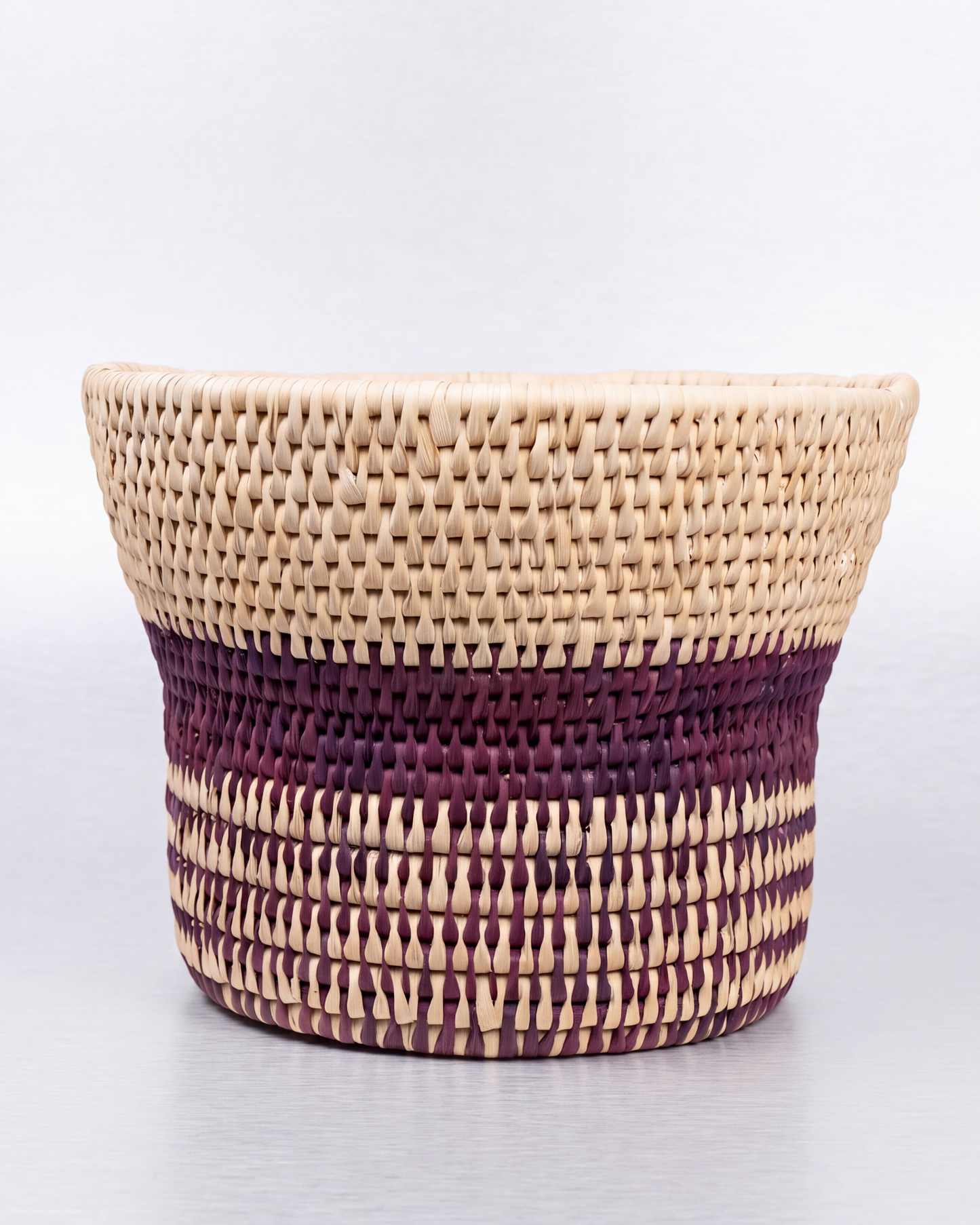 Multipurpose handwoven date-leaf basket with maroon and natural woven pattern